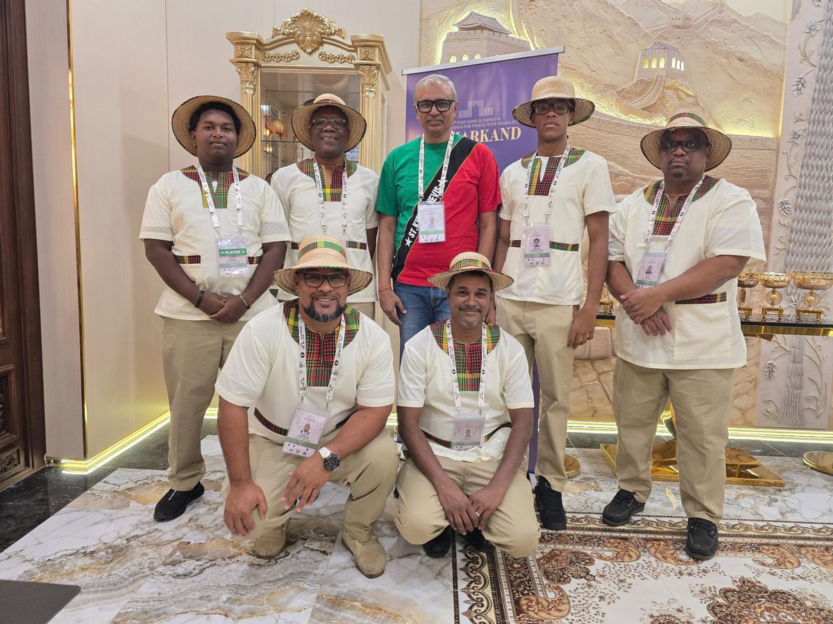 Praful Zaveri with the St. Kitts and Nevis team at the 46th Chess Olympiad
